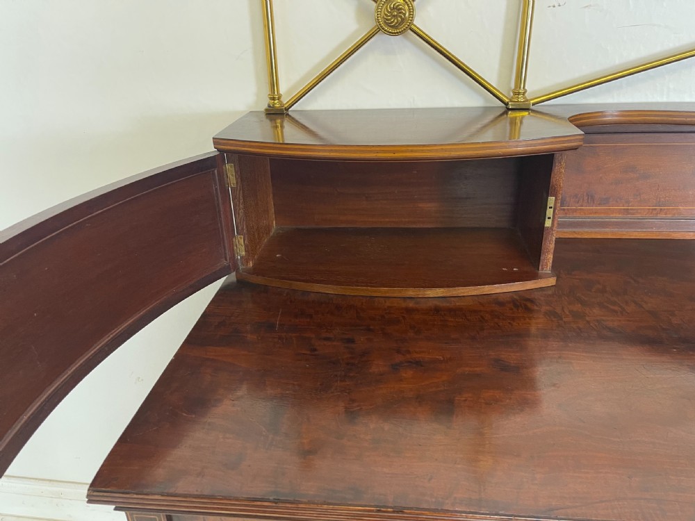 An inlaid mahogany sideboard and matching serving table featuring brass gallery rails and satinwood fan marquetry. View XXV