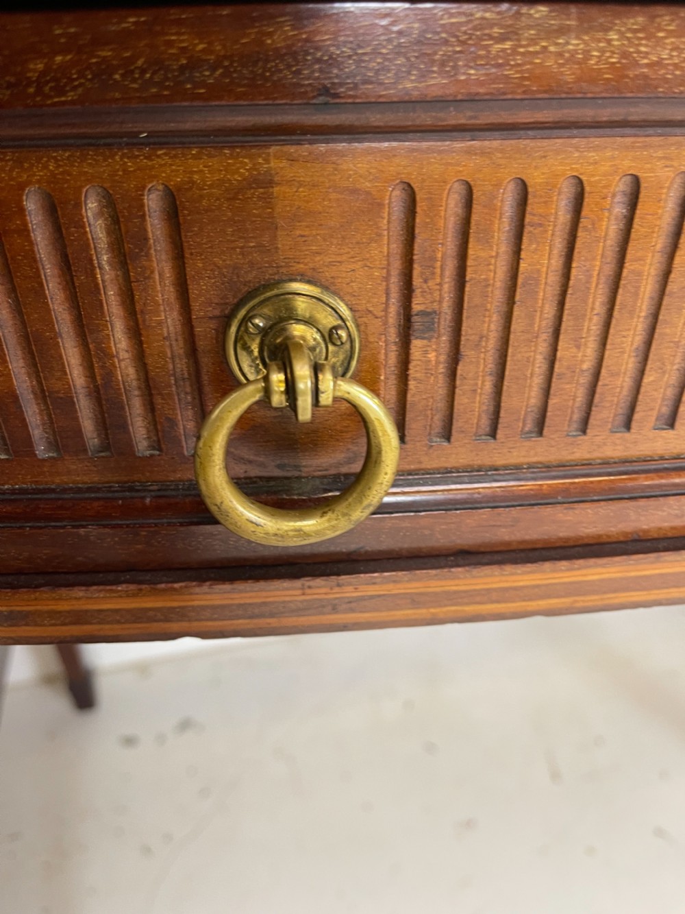 An inlaid mahogany sideboard and matching serving table featuring brass gallery rails and satinwood fan marquetry. View XXVIII