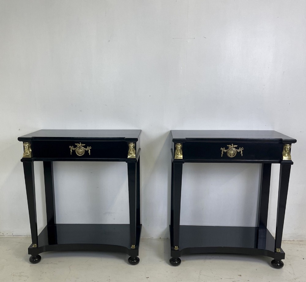 A pair of ebonised black side tables featuring single drawers, lower shelves, and gilt brass mounts on square legs. View III
