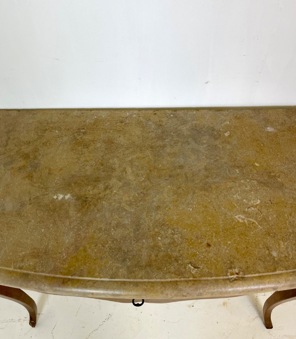 An antique French Provincial side table featuring a grey marble top, a single drawer with a carved apron, and slender cabriole legs. View IV