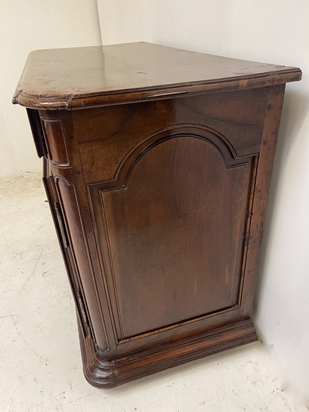 An antique French walnut buffet featuring two top drawers above two moulded panel cupboard doors with iron hardware and a solid plinth base. View II