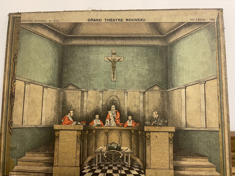 An antique wooden and paper toy puppet theatre labelled Opera, featuring miniature costumed marionettes on a painted classical stage. View XI