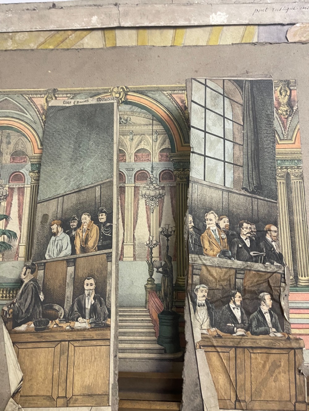 An antique wooden and paper toy puppet theatre labelled Opera, featuring miniature costumed marionettes on a painted classical stage. View XIII