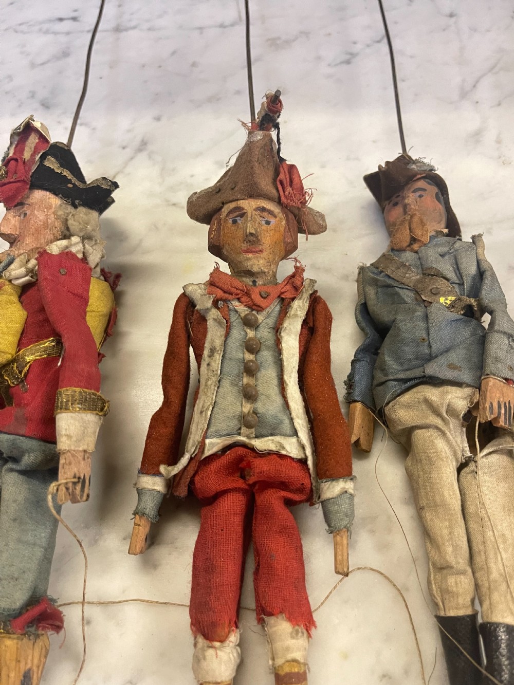 An antique wooden and paper toy puppet theatre labelled Opera, featuring miniature costumed marionettes on a painted classical stage. View XVI