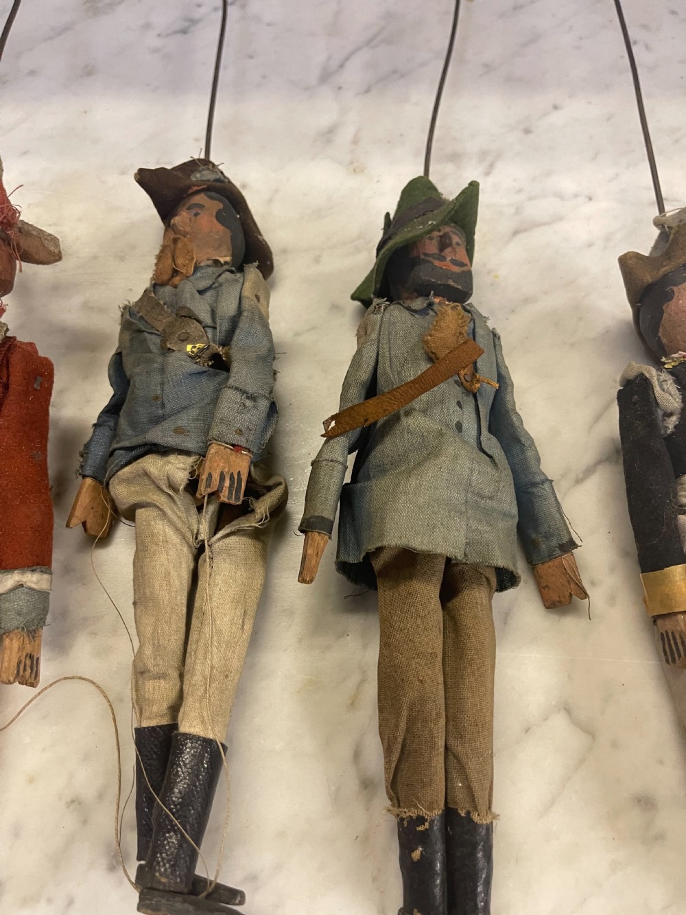 An antique wooden and paper toy puppet theatre labelled Opera, featuring miniature costumed marionettes on a painted classical stage. View XVII