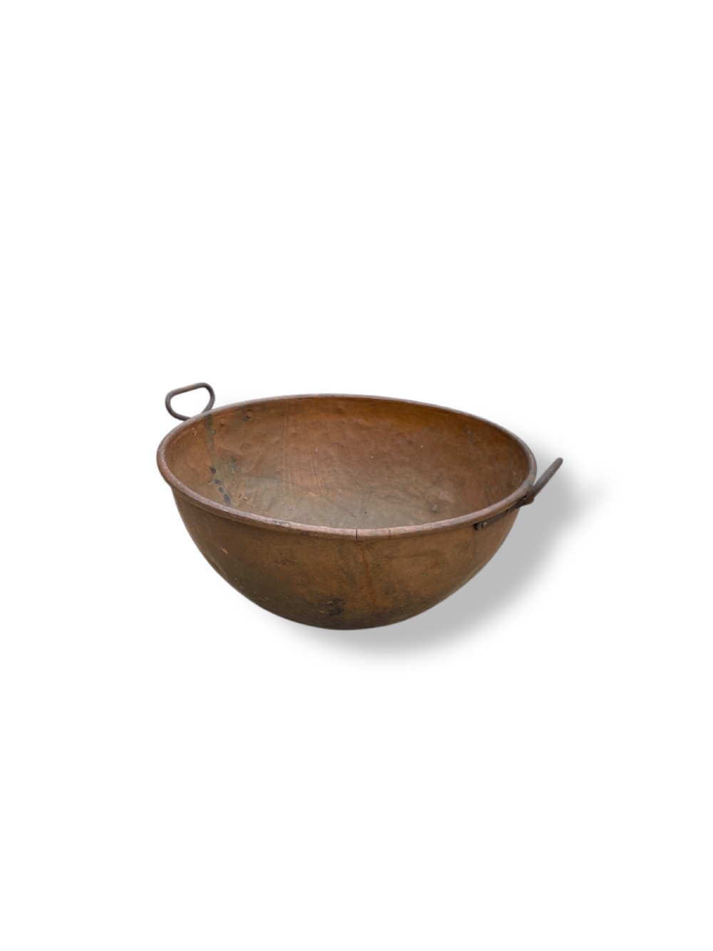 A large nineteenth-century hand-hammered copper bowl with rolled rim edges and two side loop handles. View II