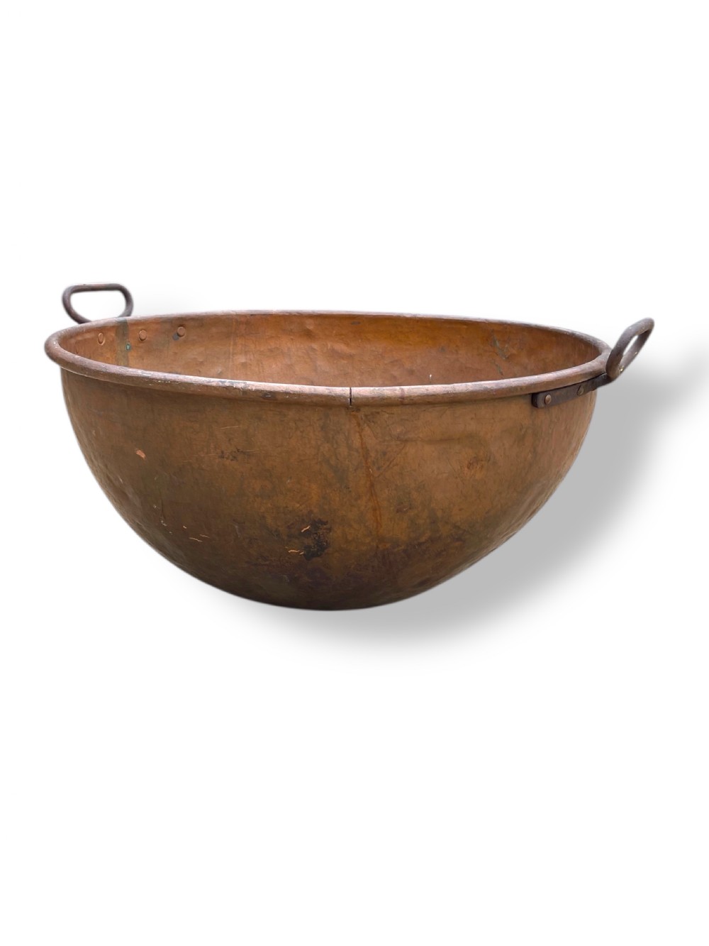 A large nineteenth-century hand-hammered copper bowl with rolled rim edges and two side loop handles. View III