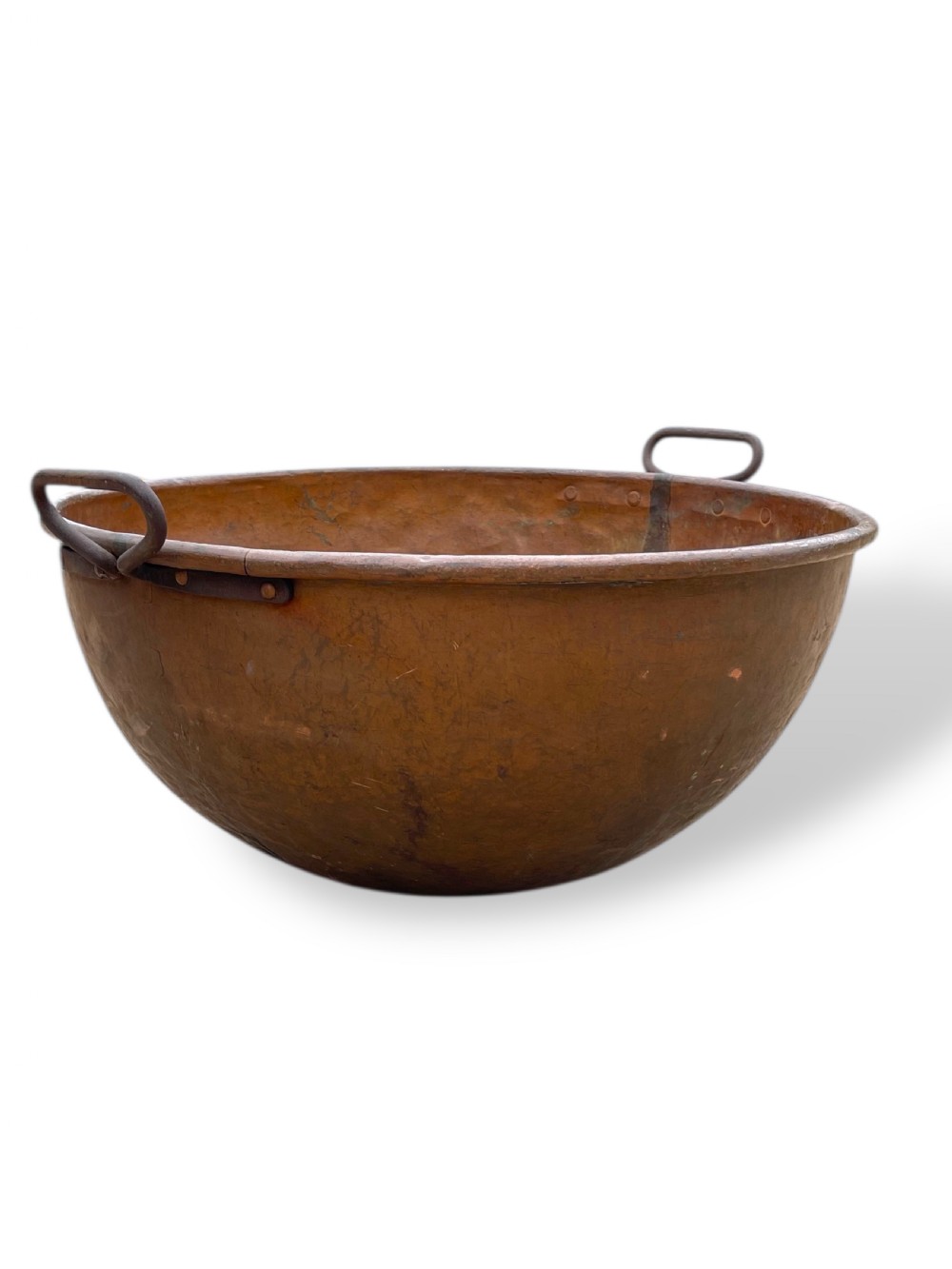 A large nineteenth-century hand-hammered copper bowl with rolled rim edges and two side loop handles. View V
