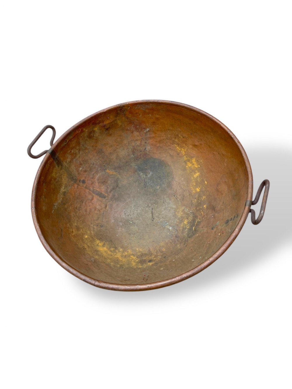 A large nineteenth-century hand-hammered copper bowl with rolled rim edges and two side loop handles. View VI