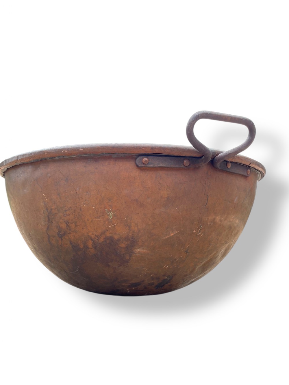 A large nineteenth-century hand-hammered copper bowl with rolled rim edges and two side loop handles. View IX
