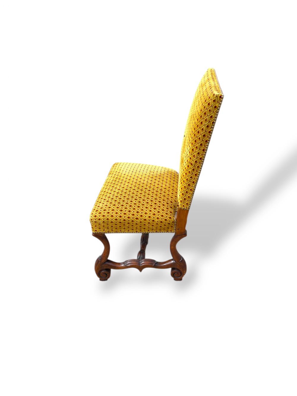 A set of six French walnut dining chairs upholstered in gold patterned fabric with carved wooden legs and stretchers. View II