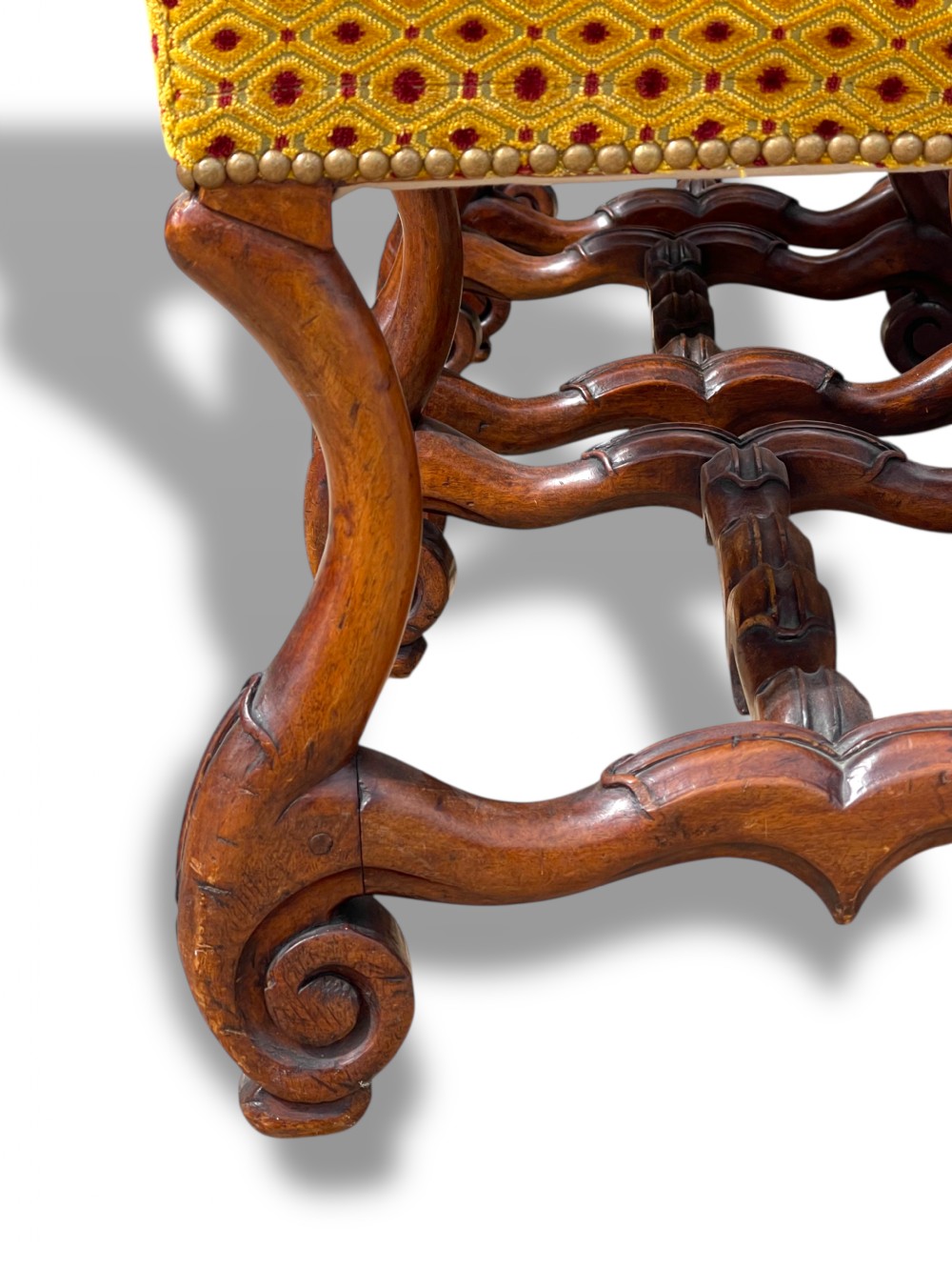 A set of six French walnut dining chairs upholstered in gold patterned fabric with carved wooden legs and stretchers. View VIII