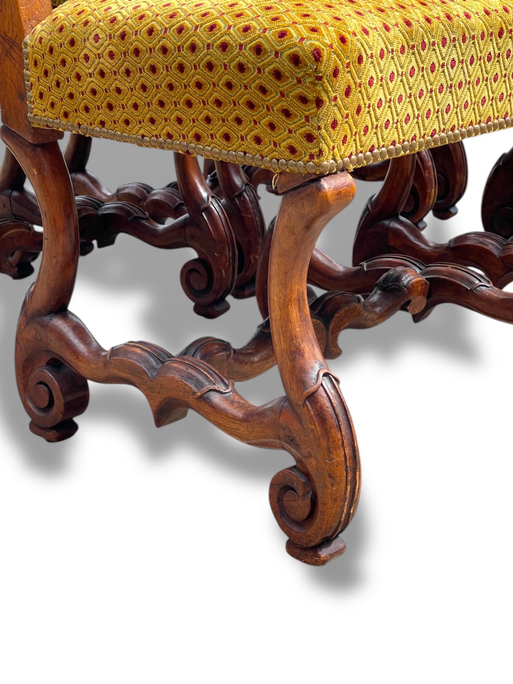 A set of six French walnut dining chairs upholstered in gold patterned fabric with carved wooden legs and stretchers. View IX