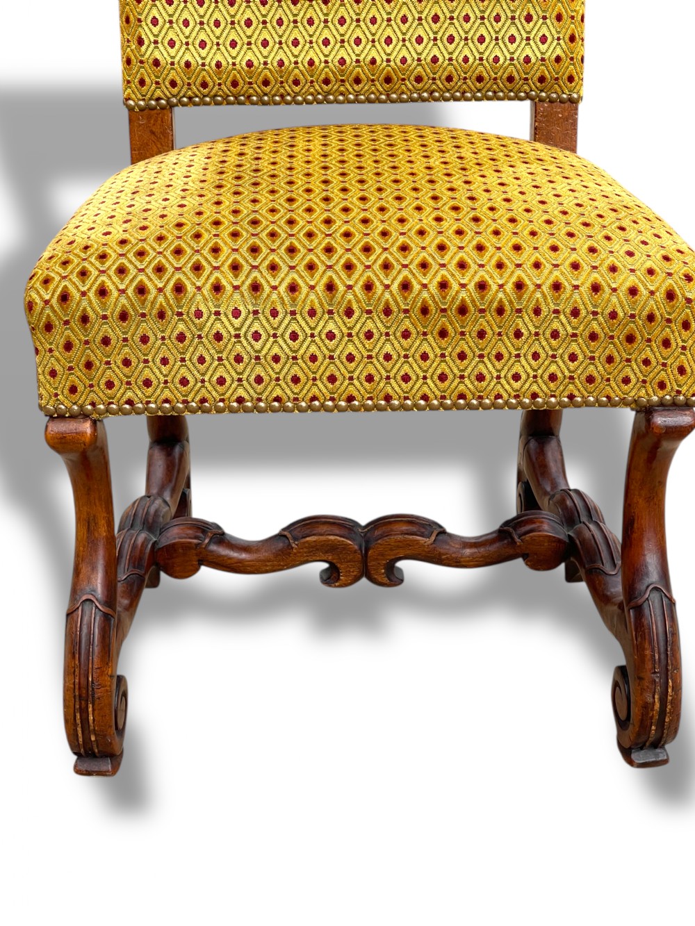 A set of six French walnut dining chairs upholstered in gold patterned fabric with carved wooden legs and stretchers. View XIII