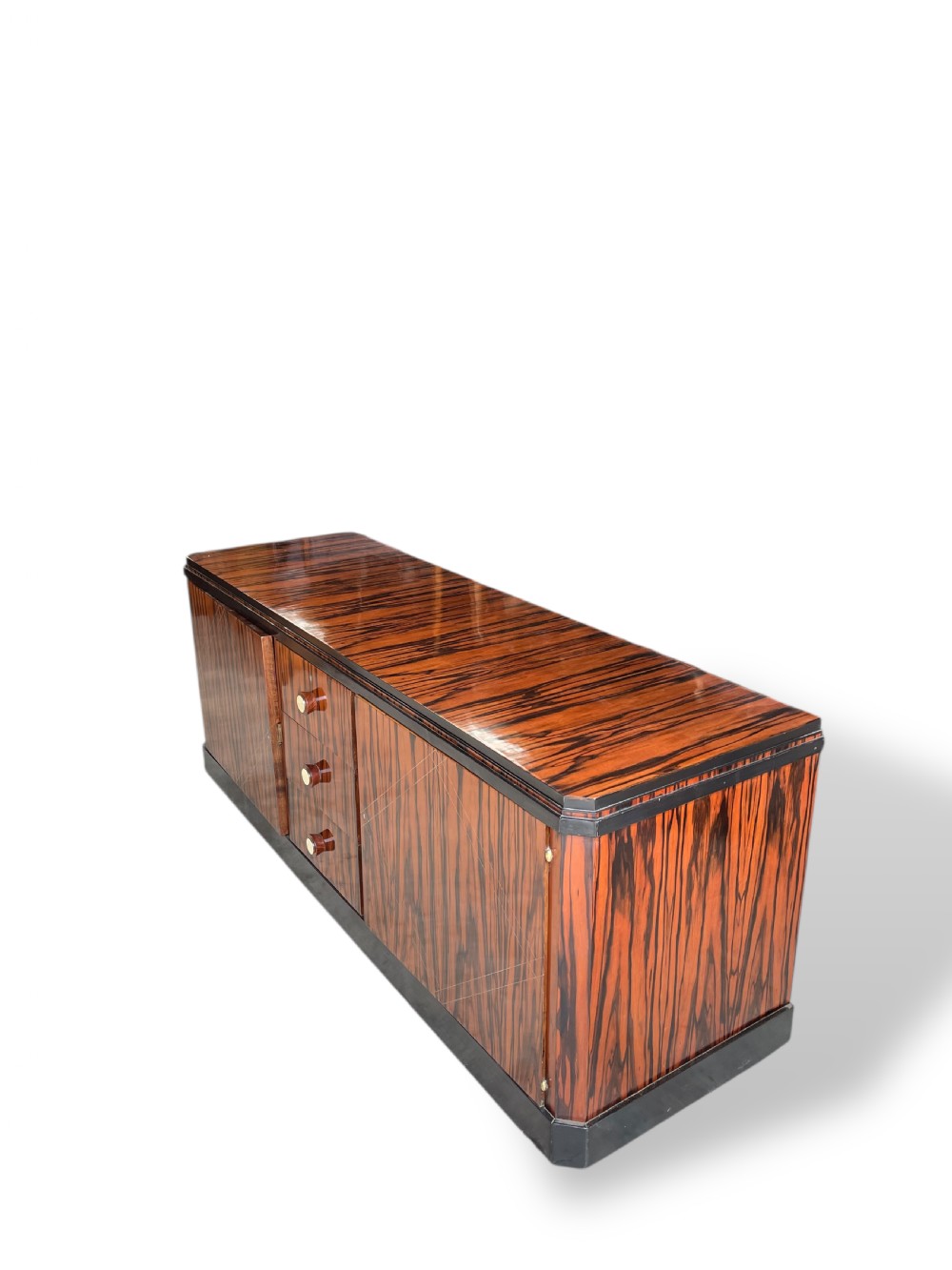 A low-profile French Art Deco sideboard in high-gloss Macassar ebony veneer with central drawers and geometric side door details. View V