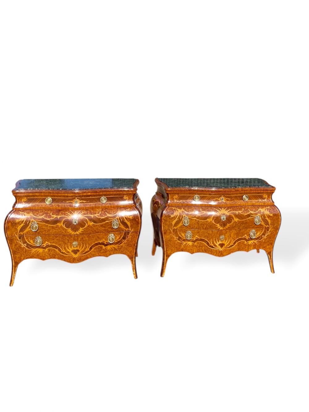 A pair of Italian bombe commodes featuring intricate floral marquetry timber inlays, dark green marble tops, and brass handles. View II