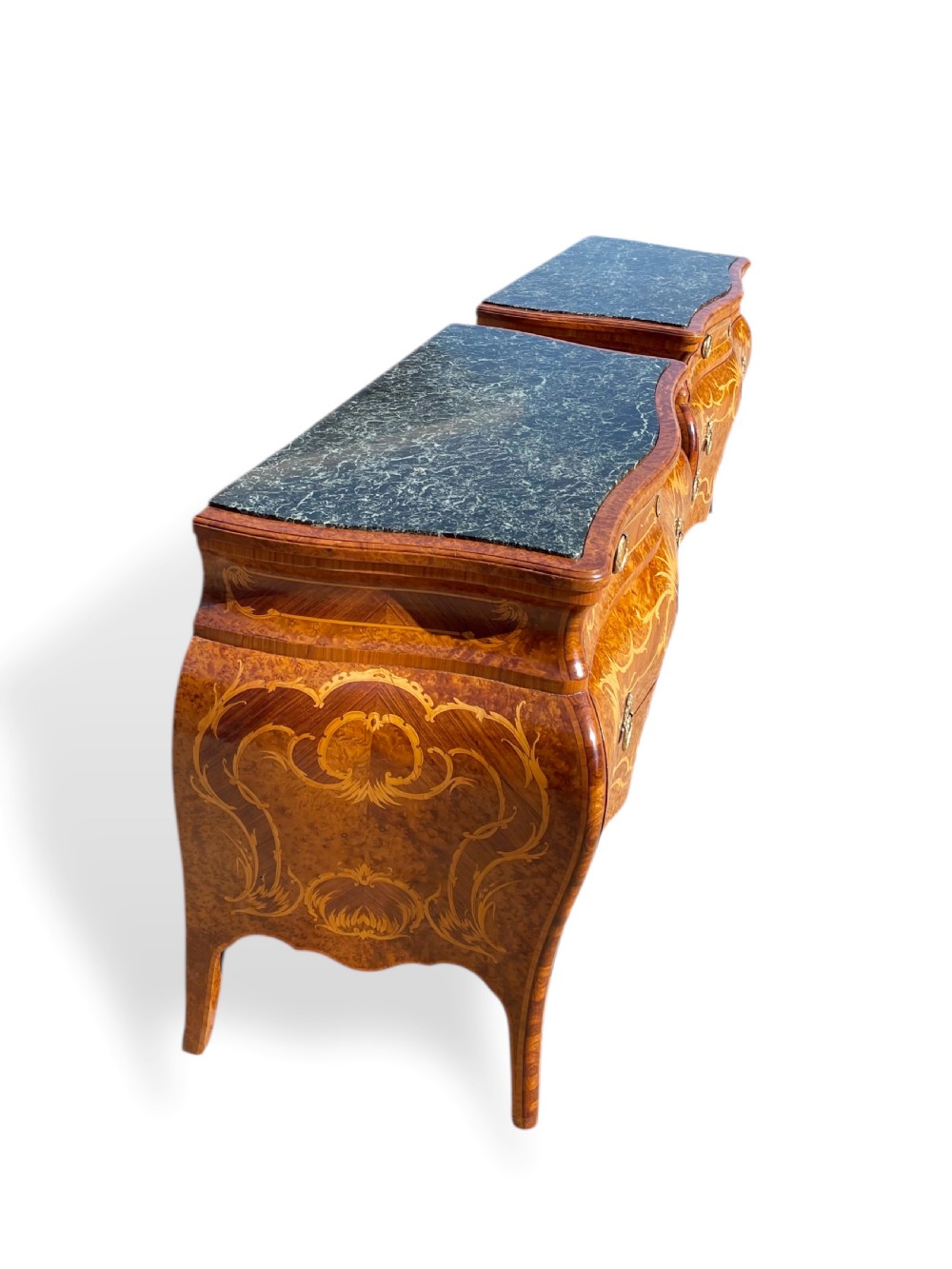 A pair of Italian bombe commodes featuring intricate floral marquetry timber inlays, dark green marble tops, and brass handles. View VIII