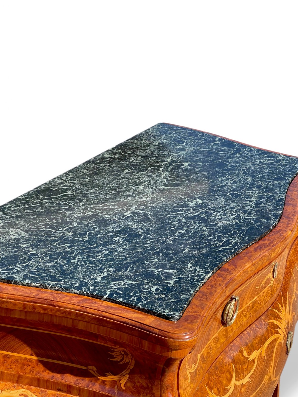 A pair of Italian bombe commodes featuring intricate floral marquetry timber inlays, dark green marble tops, and brass handles. View IX