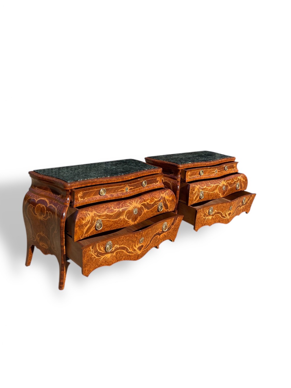 A pair of Italian bombe commodes featuring intricate floral marquetry timber inlays, dark green marble tops, and brass handles. View XVI
