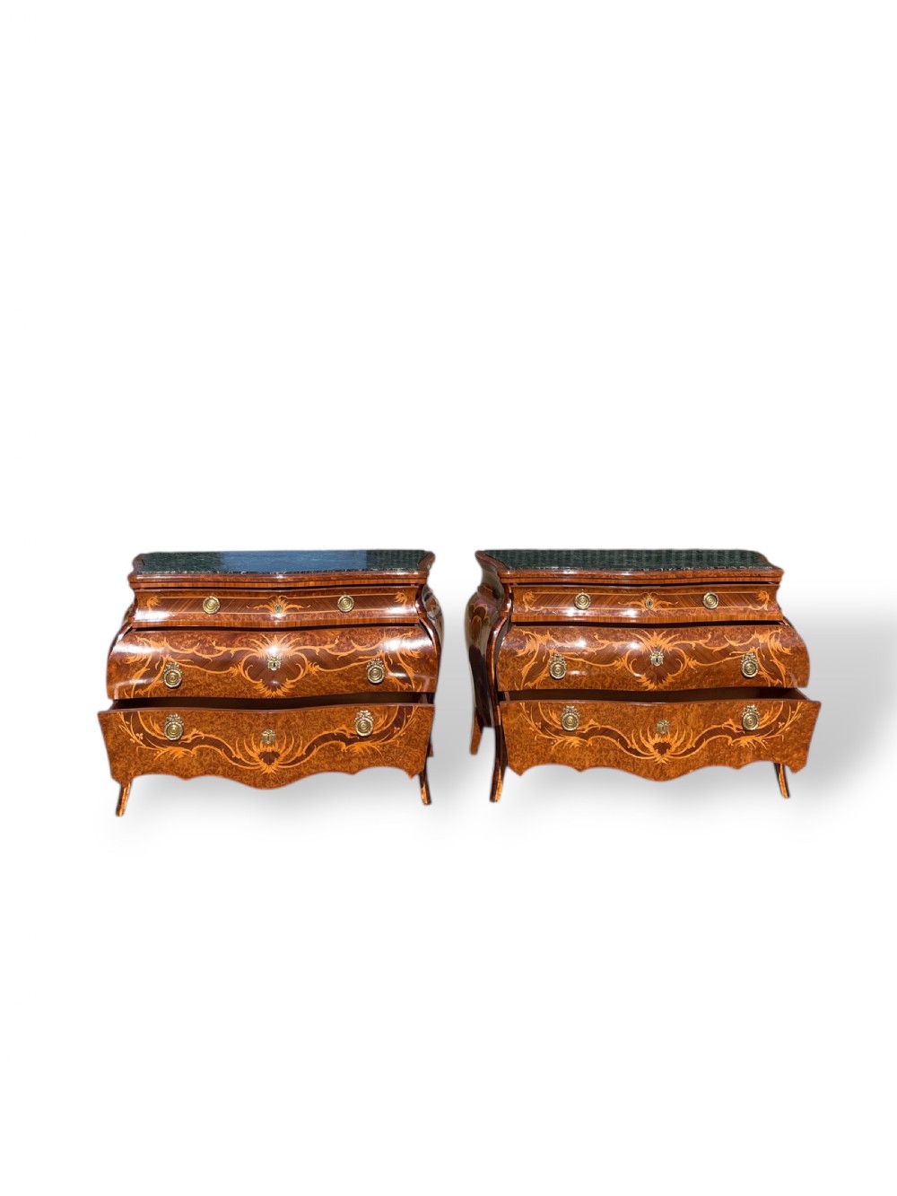 A pair of Italian bombe commodes featuring intricate floral marquetry timber inlays, dark green marble tops, and brass handles. View XVIII