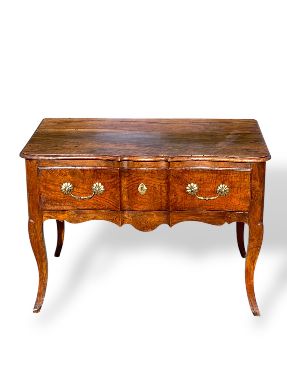 An 18th-century French walnut side table featuring a contoured serpentine front, single drawer with decorative brass handles, a shaped apron, and curved cabriole legs. View III