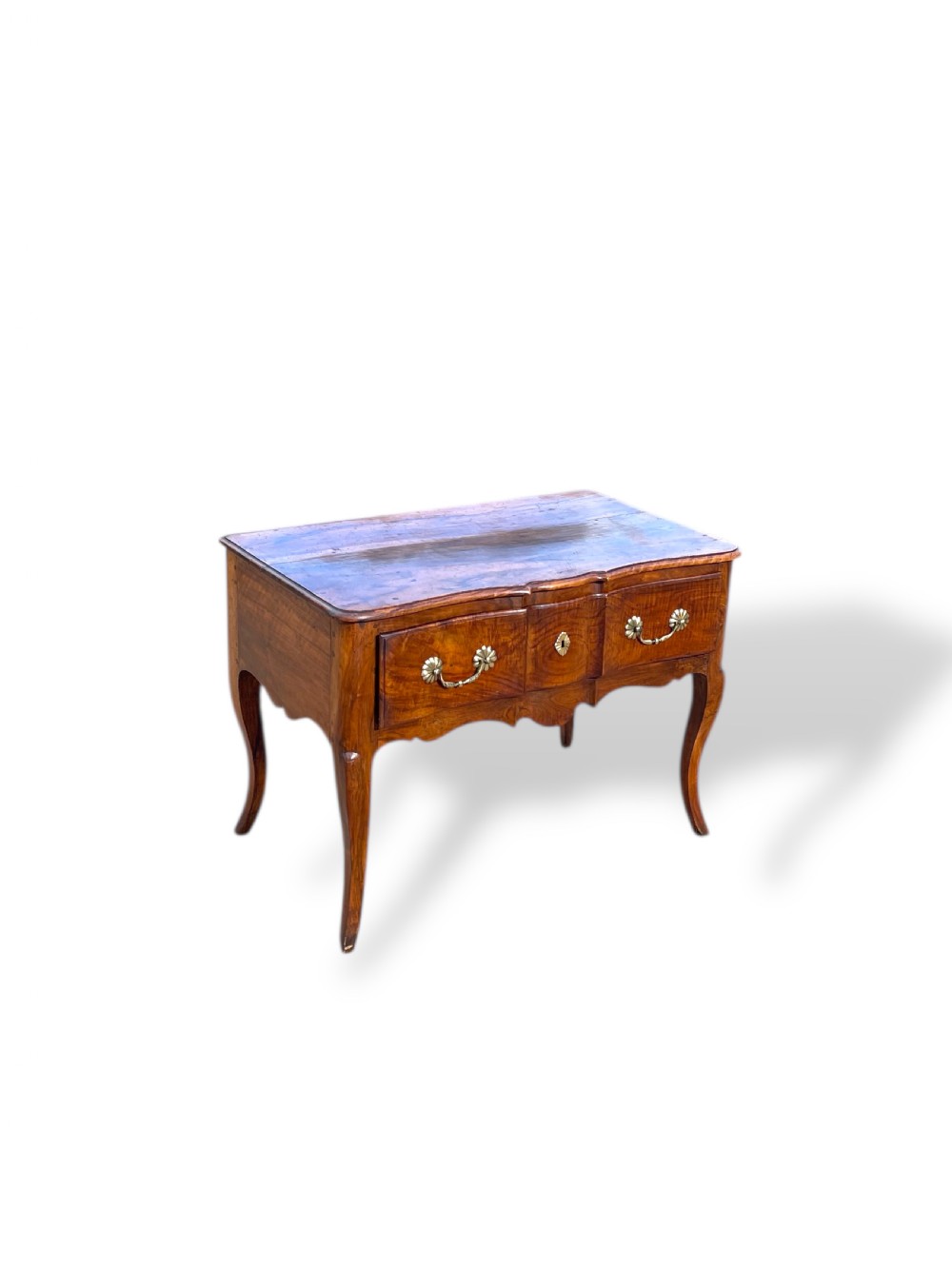 An 18th-century French walnut side table featuring a contoured serpentine front, single drawer with decorative brass handles, a shaped apron, and curved cabriole legs. View IV