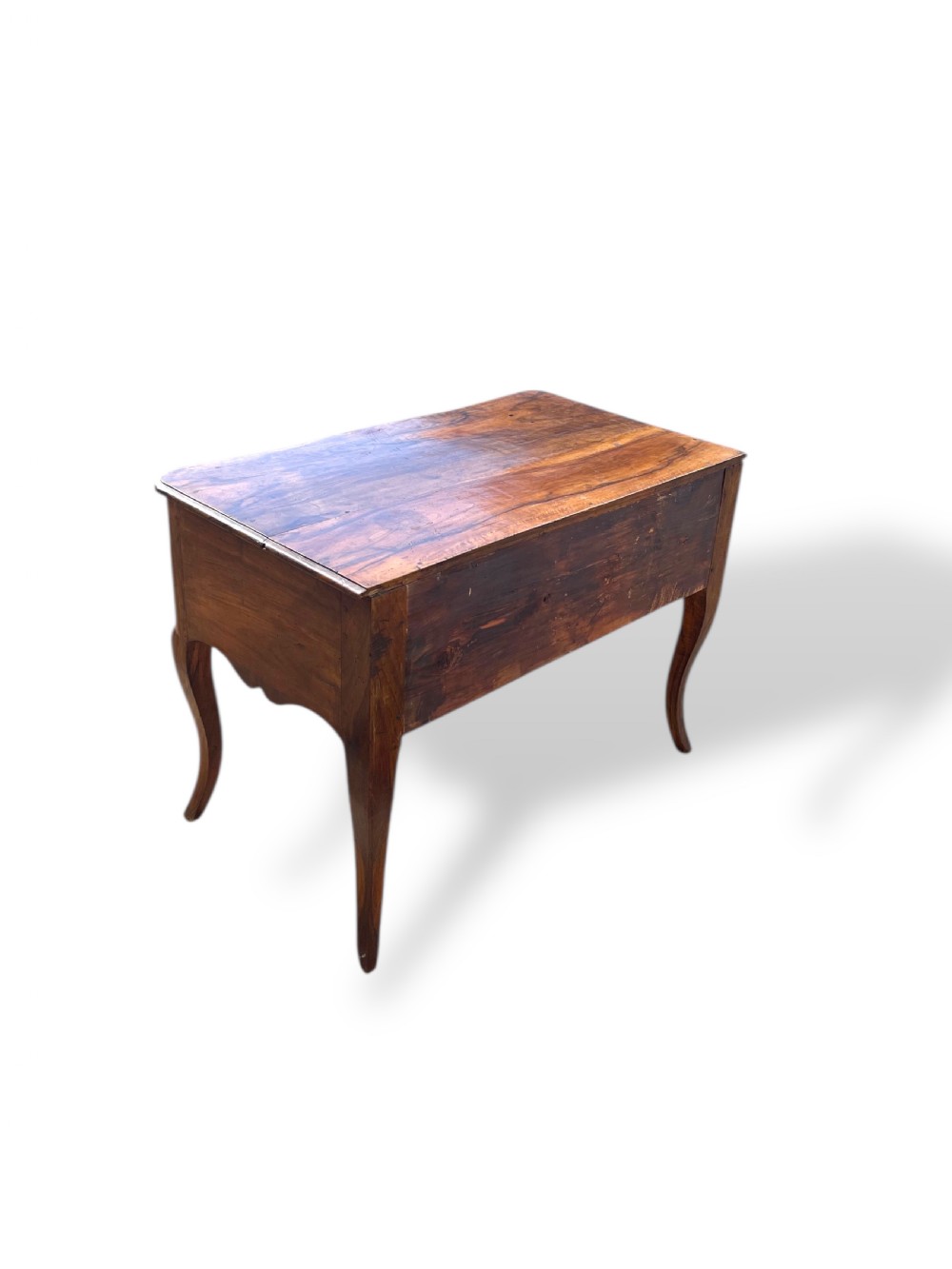 An 18th-century French walnut side table featuring a contoured serpentine front, single drawer with decorative brass handles, a shaped apron, and curved cabriole legs. View VI
