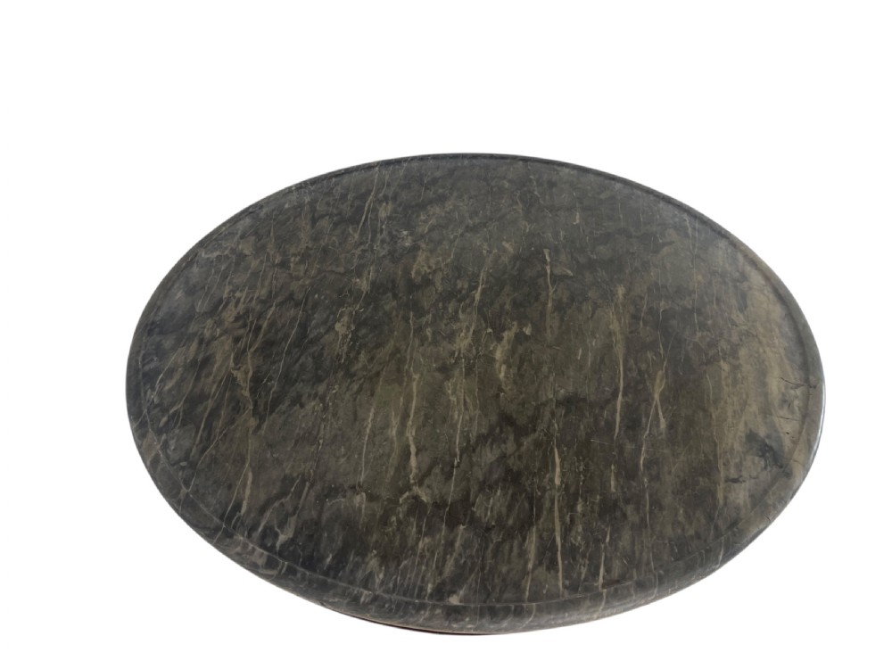 An early nineteenth-century French Empire gueridon table with a circular grey veined marble top resting on a mahogany base with carved ram heads. View IX