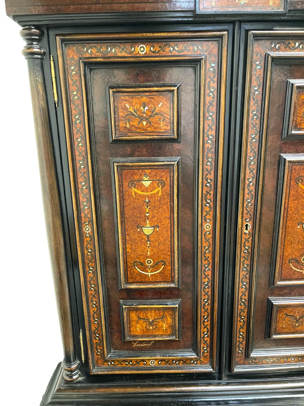 A two-part dark walnut Spanish buffet cabinet featuring detailed marquetry and bone inlay across four panelled cupboard doors and two upper drawers. View III