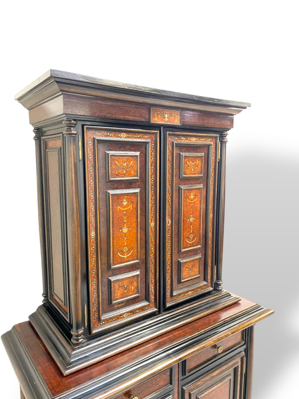 A two-part dark walnut Spanish buffet cabinet featuring detailed marquetry and bone inlay across four panelled cupboard doors and two upper drawers. View V