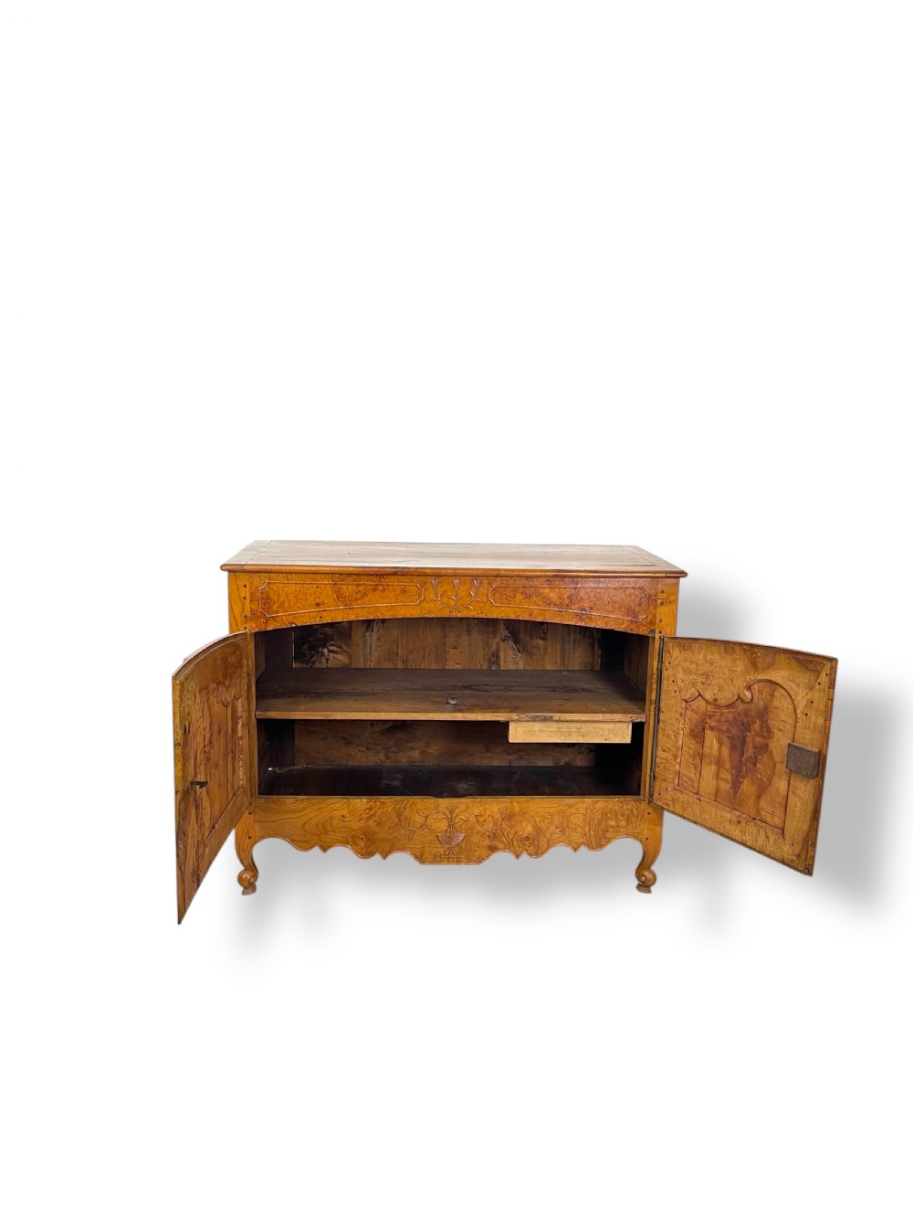 A French burr elm provincial dresser featuring two panelled doors with intricate grain patterns, steel escutcheons, a carved apron, and cabriole legs. View VIII