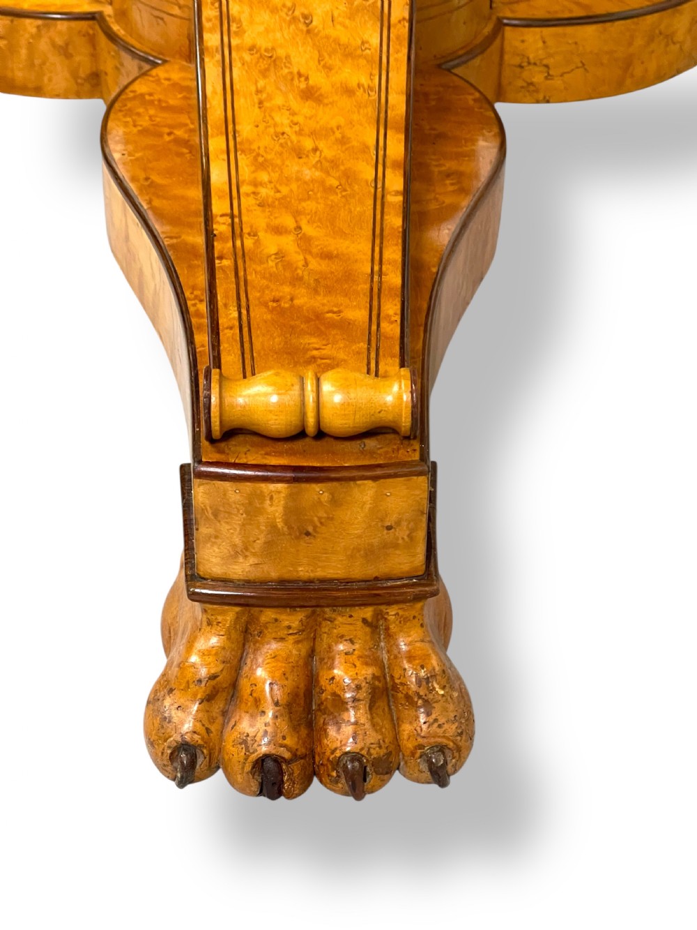 A circular antique French Empire gueridon table featuring a grey-veined marble top on a carved wooden pedestal with a triform base and lion paw feet. View VIII
