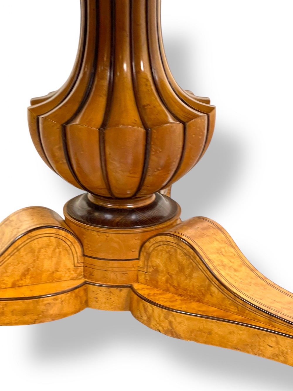 A circular antique French Empire gueridon table featuring a grey-veined marble top on a carved wooden pedestal with a triform base and lion paw feet. View XIII