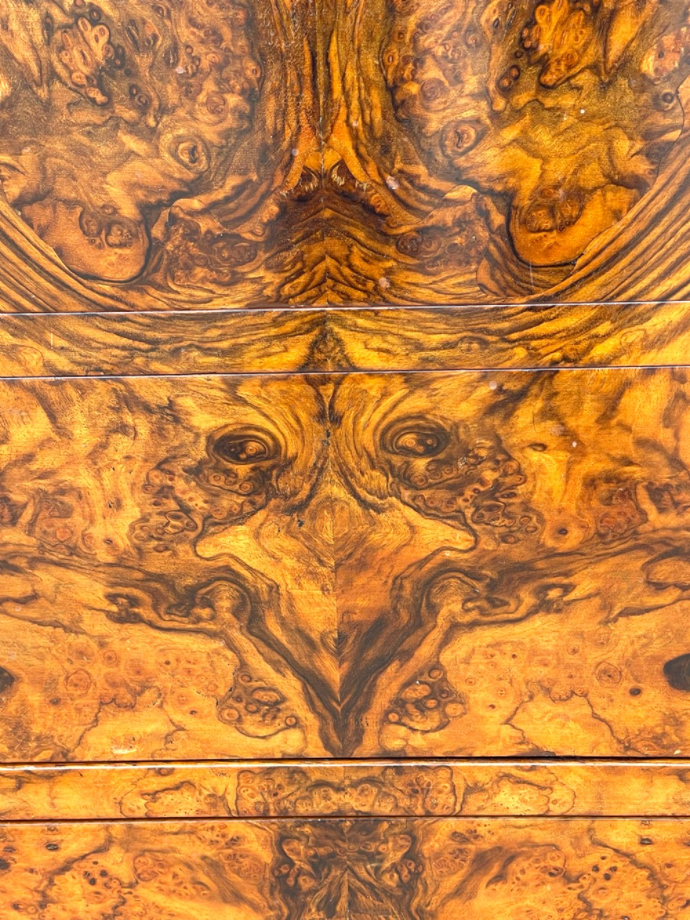 A 19th-century French Louis Philippe walnut commode featuring a grey marble top surface and figured walnut timber drawers with brass keyhole escutcheons. View III