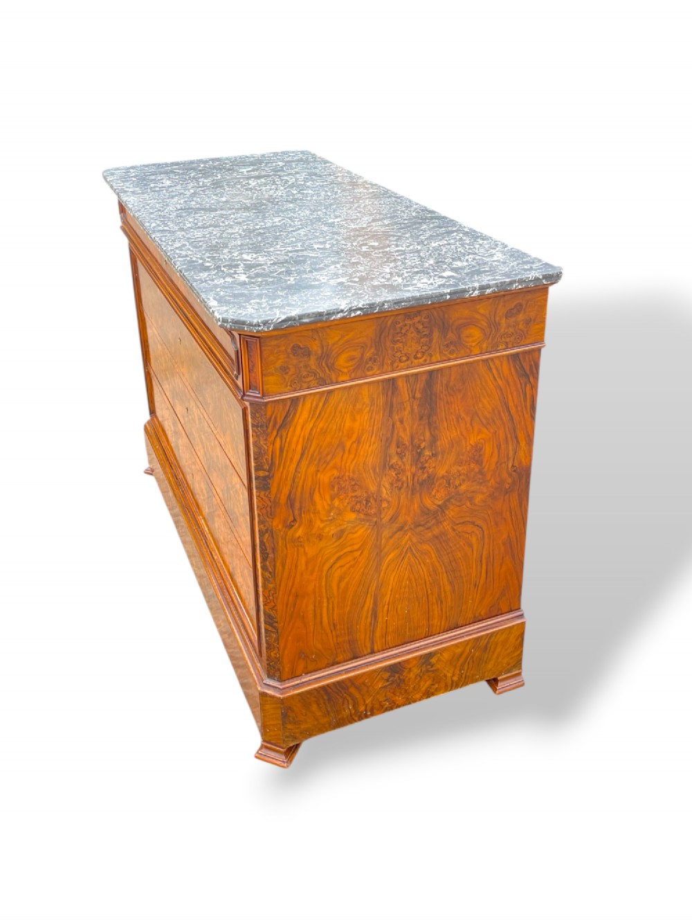 A 19th-century French Louis Philippe walnut commode featuring a grey marble top surface and figured walnut timber drawers with brass keyhole escutcheons. View IV