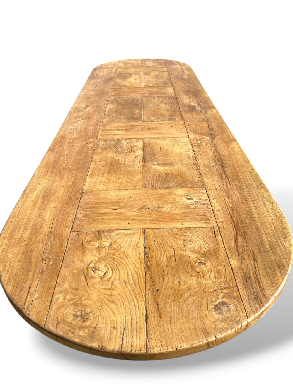 A four-metre French oak refectory dining table with rounded ends, a panelled timber top, and turned baluster legs set on trestle bases. View XIV