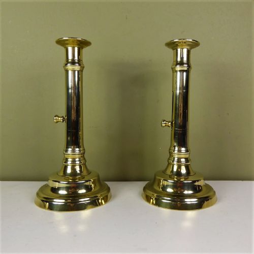 A Pair of Brass Candle Sticks