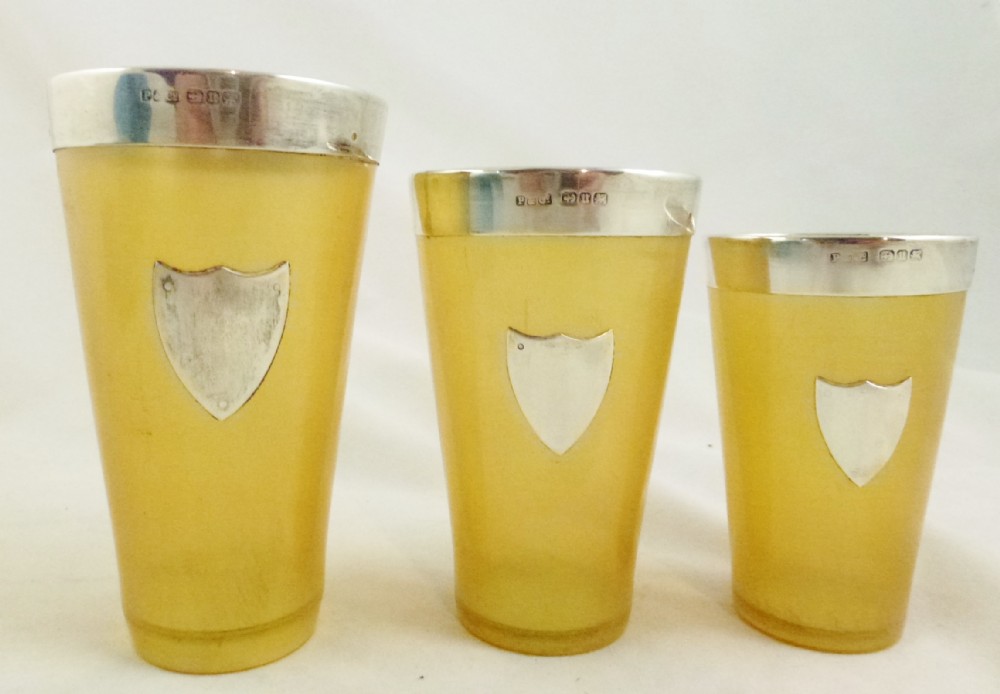 SET OF SILVER MOUNTED HORN BEAKERS