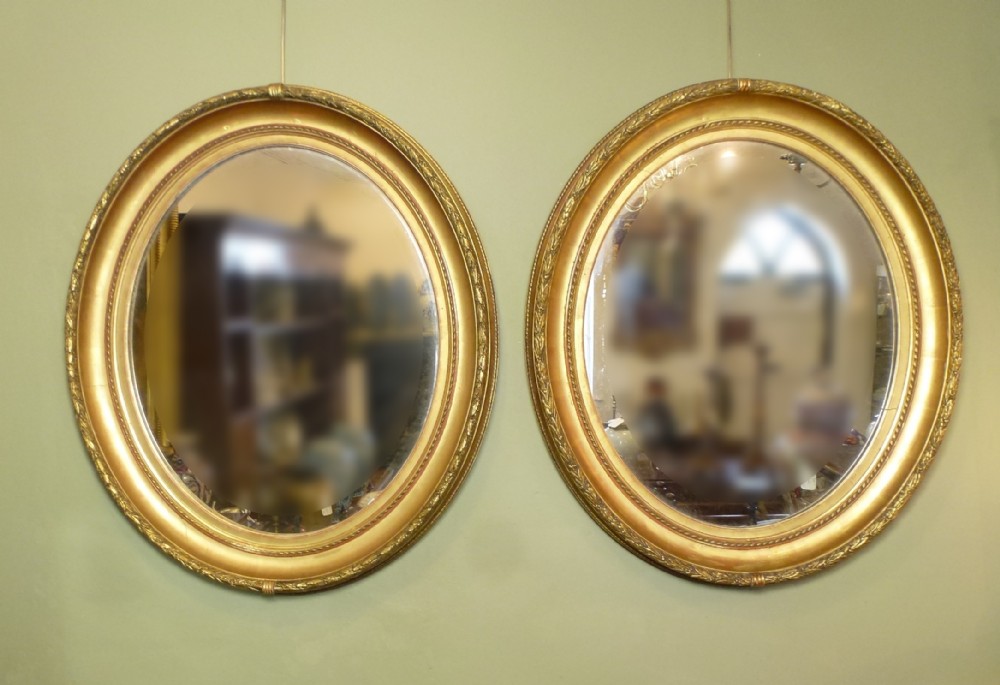 PAIR LARGE ANTIQUE 19TH C OVAL GILT MIRRORS
