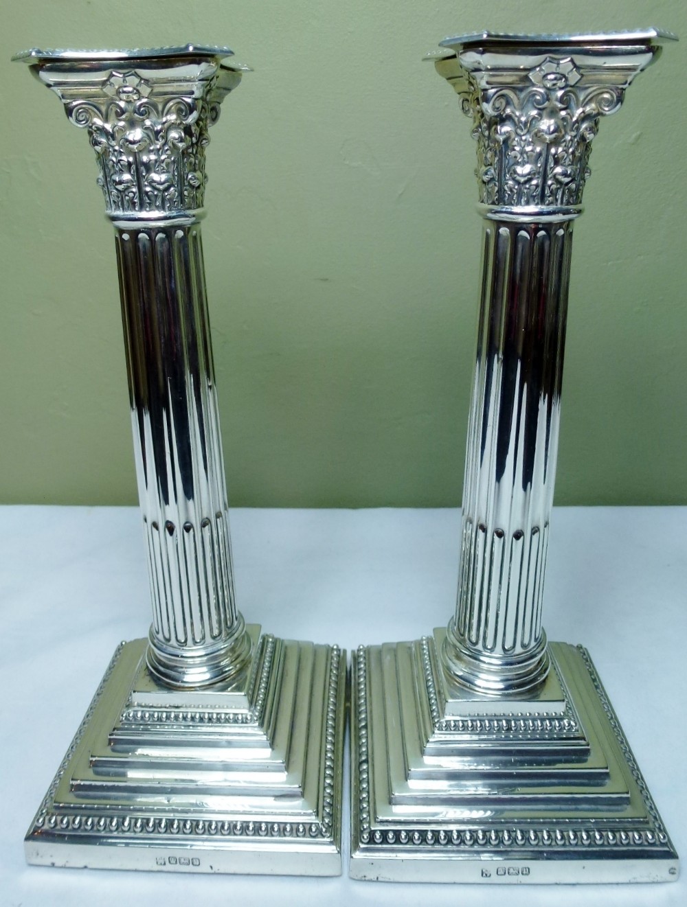 Silver Corinthian column candle sticks