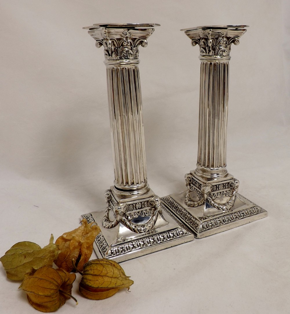 Pair of Corinthian candle sticks