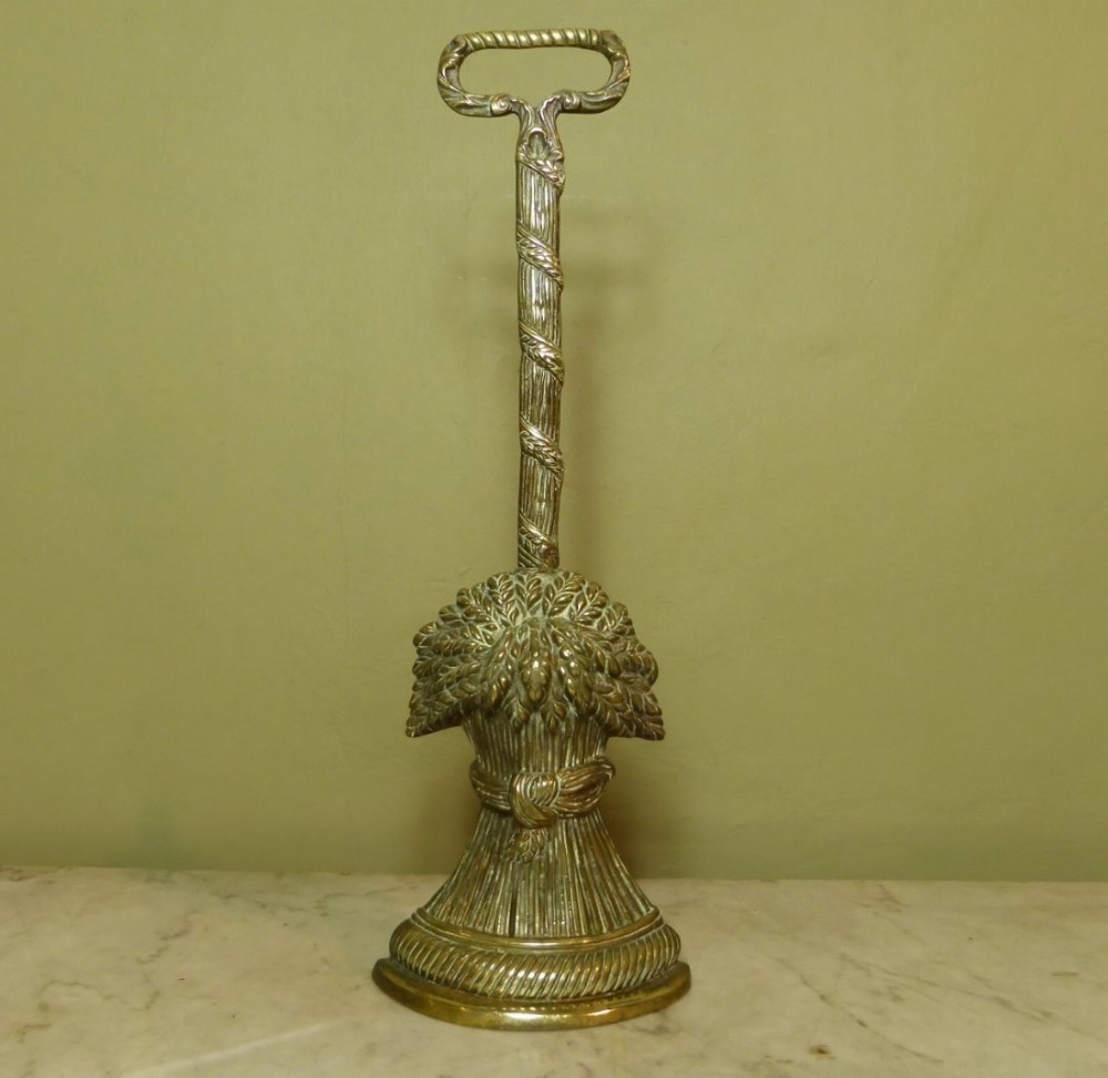 19TH C BRASS DOOR STOP