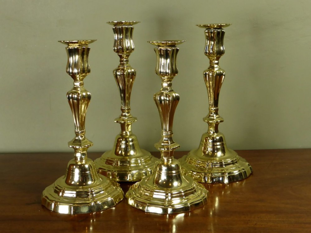 SET OF FOUR 18TH C BRASS CANDLESTICKS