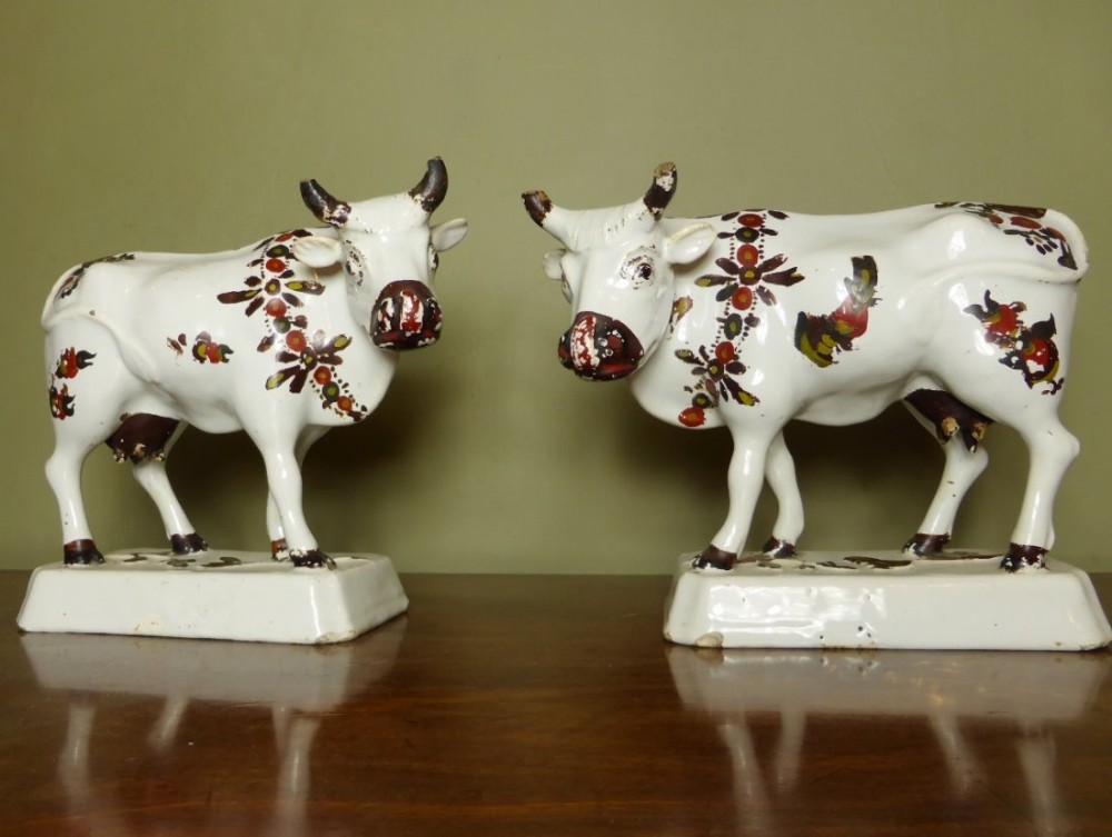 PAIR OF 18TH C DELFT COWS
