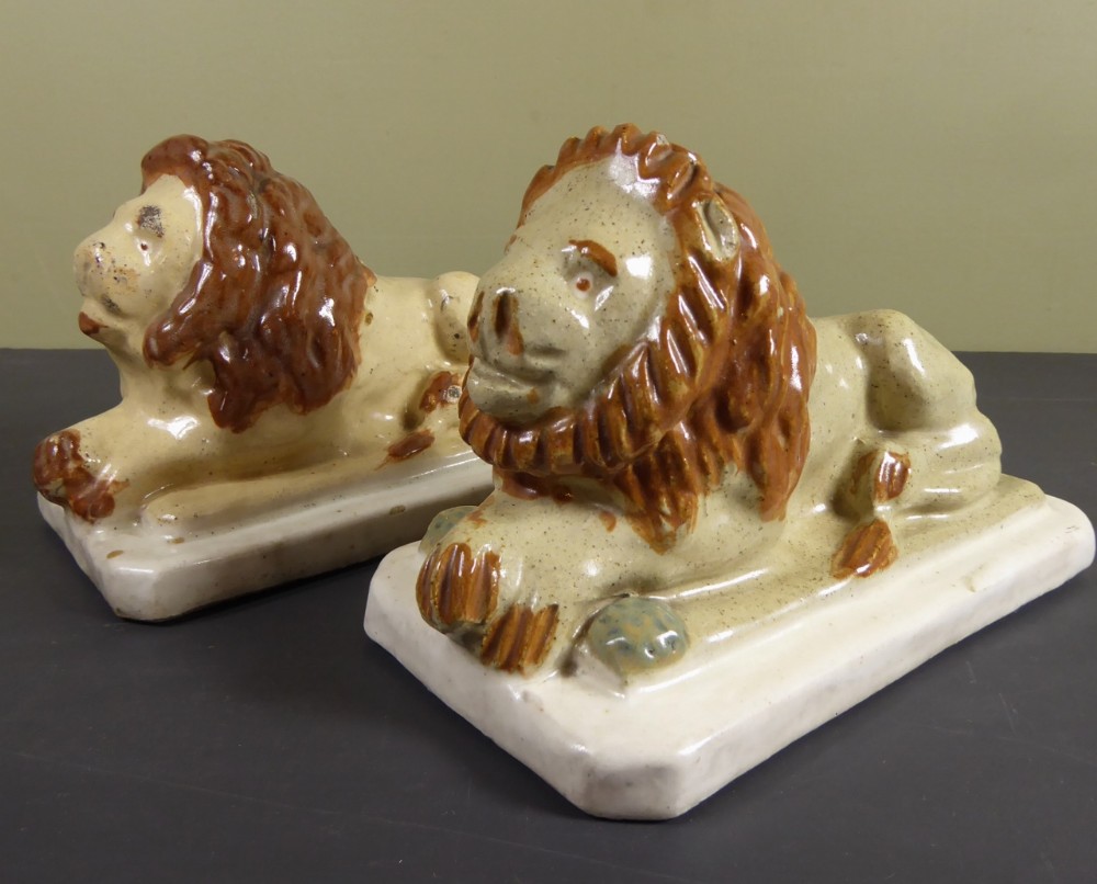 PAIR OF 19TH C GLAZED LIONS