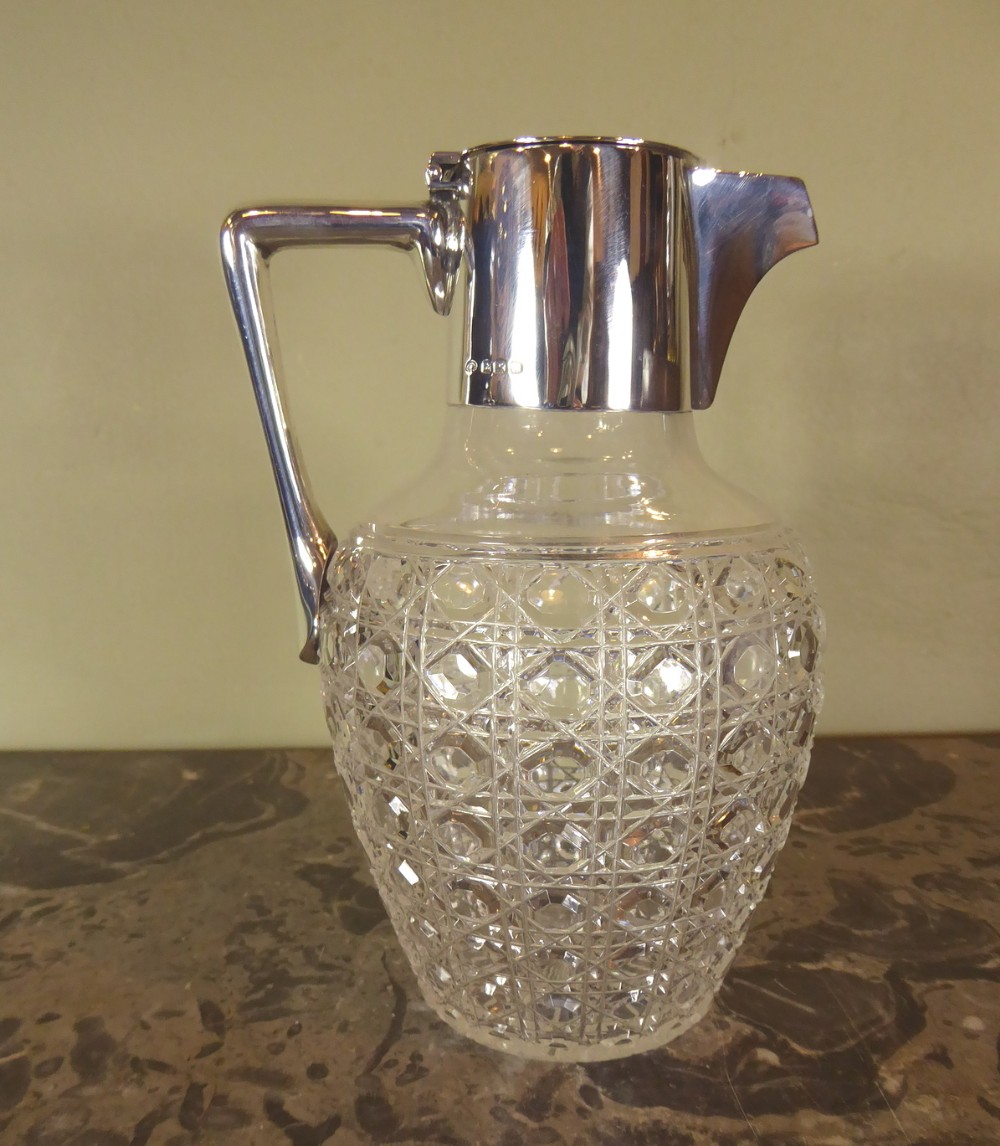 SILVER MOUNTED CUT GLASS CLARET JUG