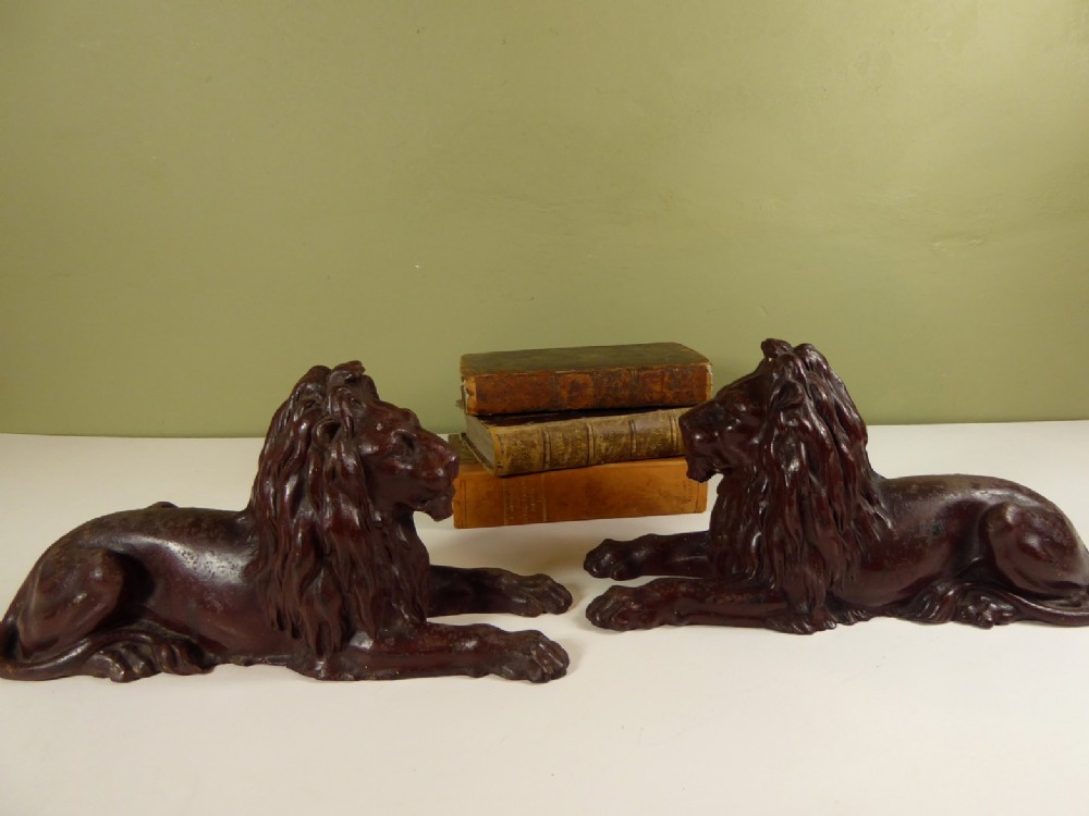 PAIR OF 19TH C CAST IRON LIONS