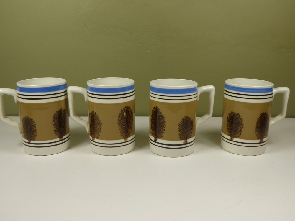 SET OF FOUR 19TH C MOCHA WARE MUGS