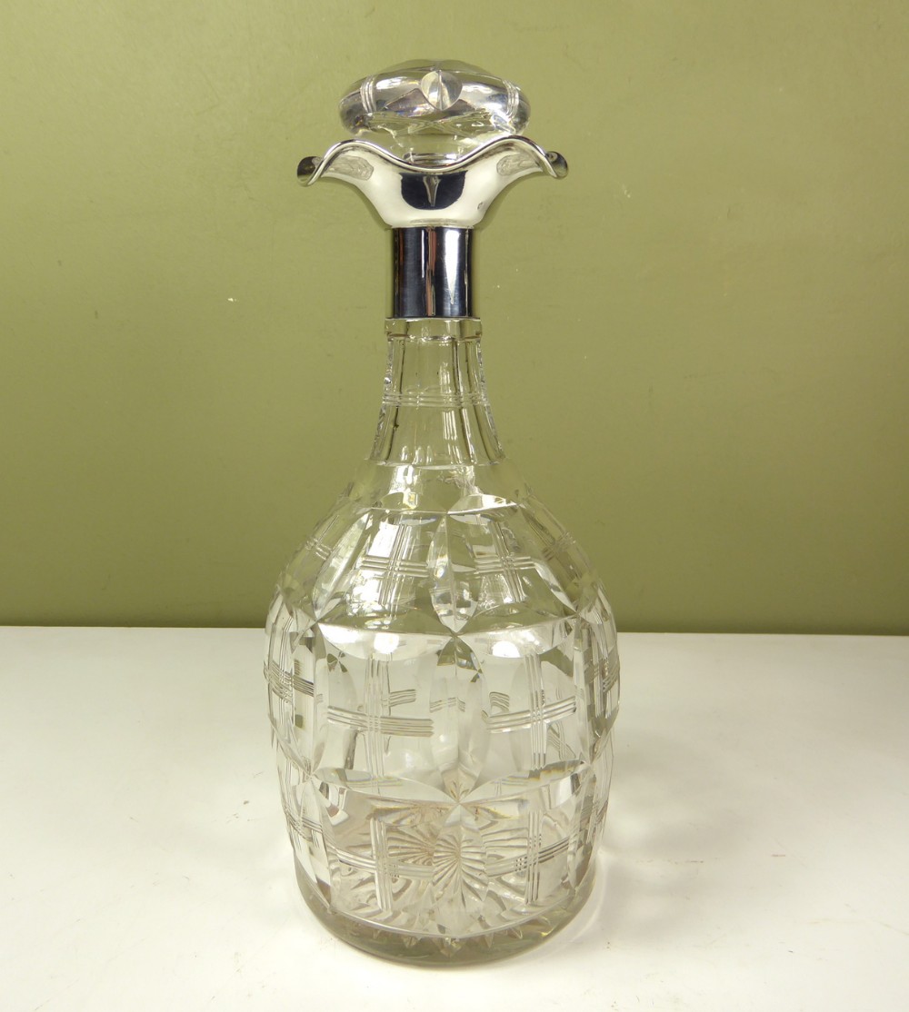 SILVER MOUNTED GLASS DECANTER