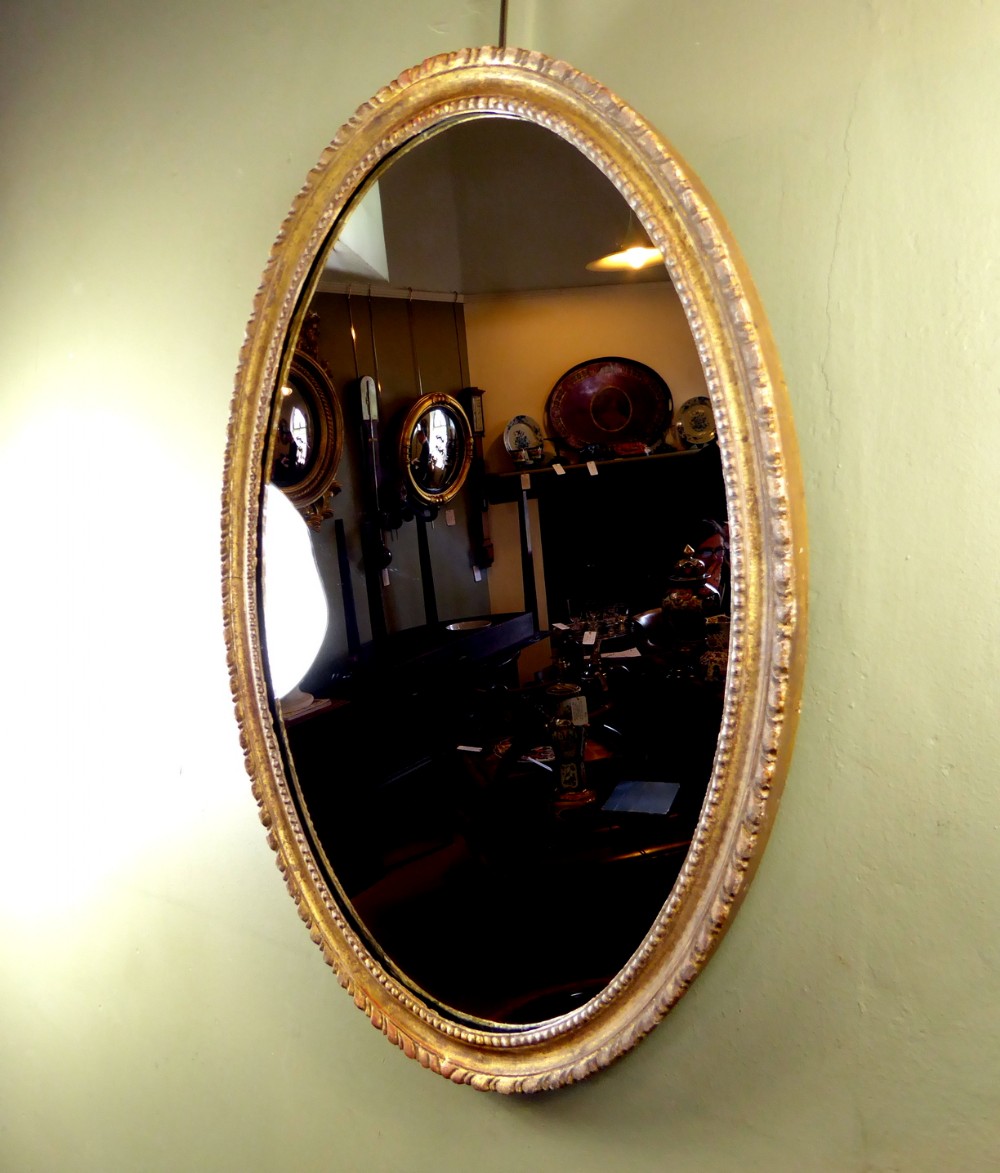18TH C OVAL GILT WOOD MIRROR
